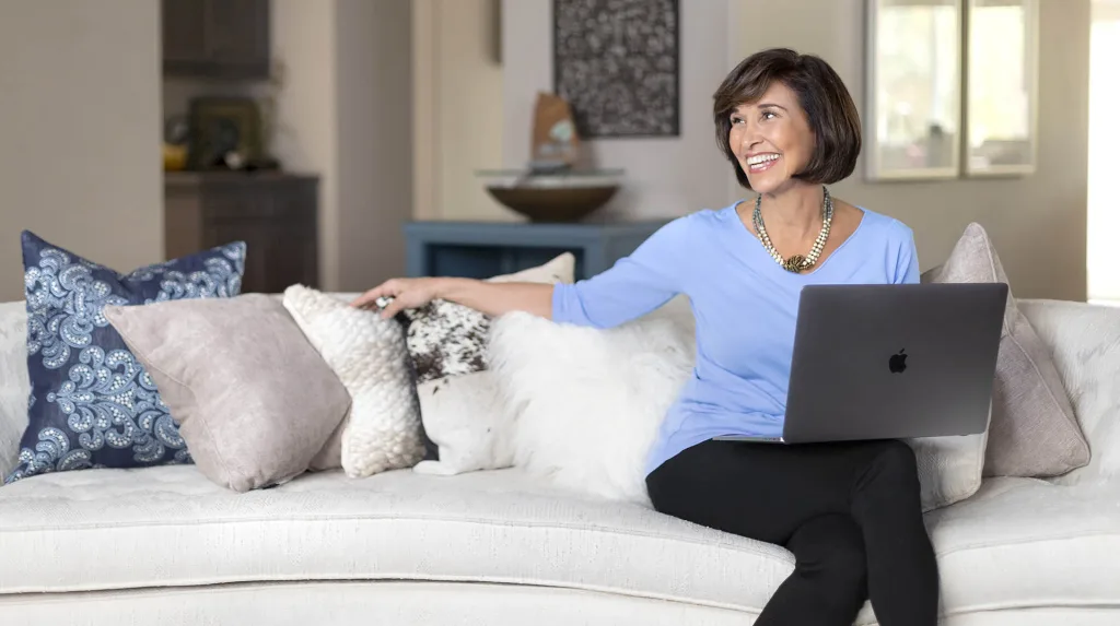 Personal brand photography of woman with computer.