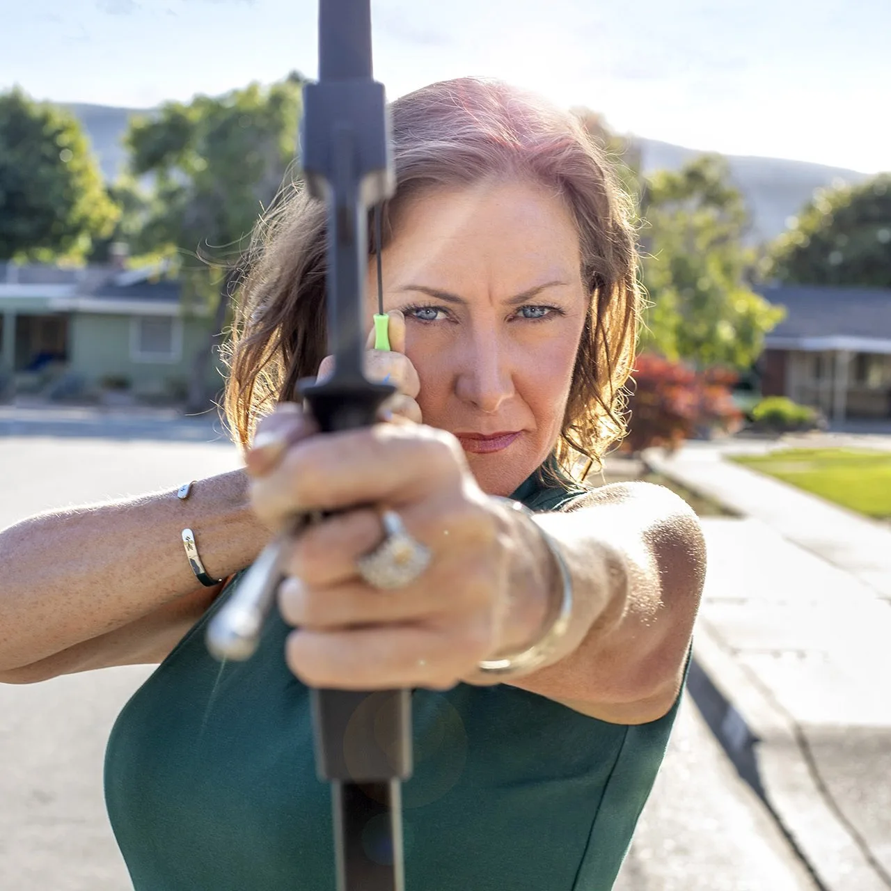 AngelC_1872-sq Woman holding a bow and arrow being strategic.