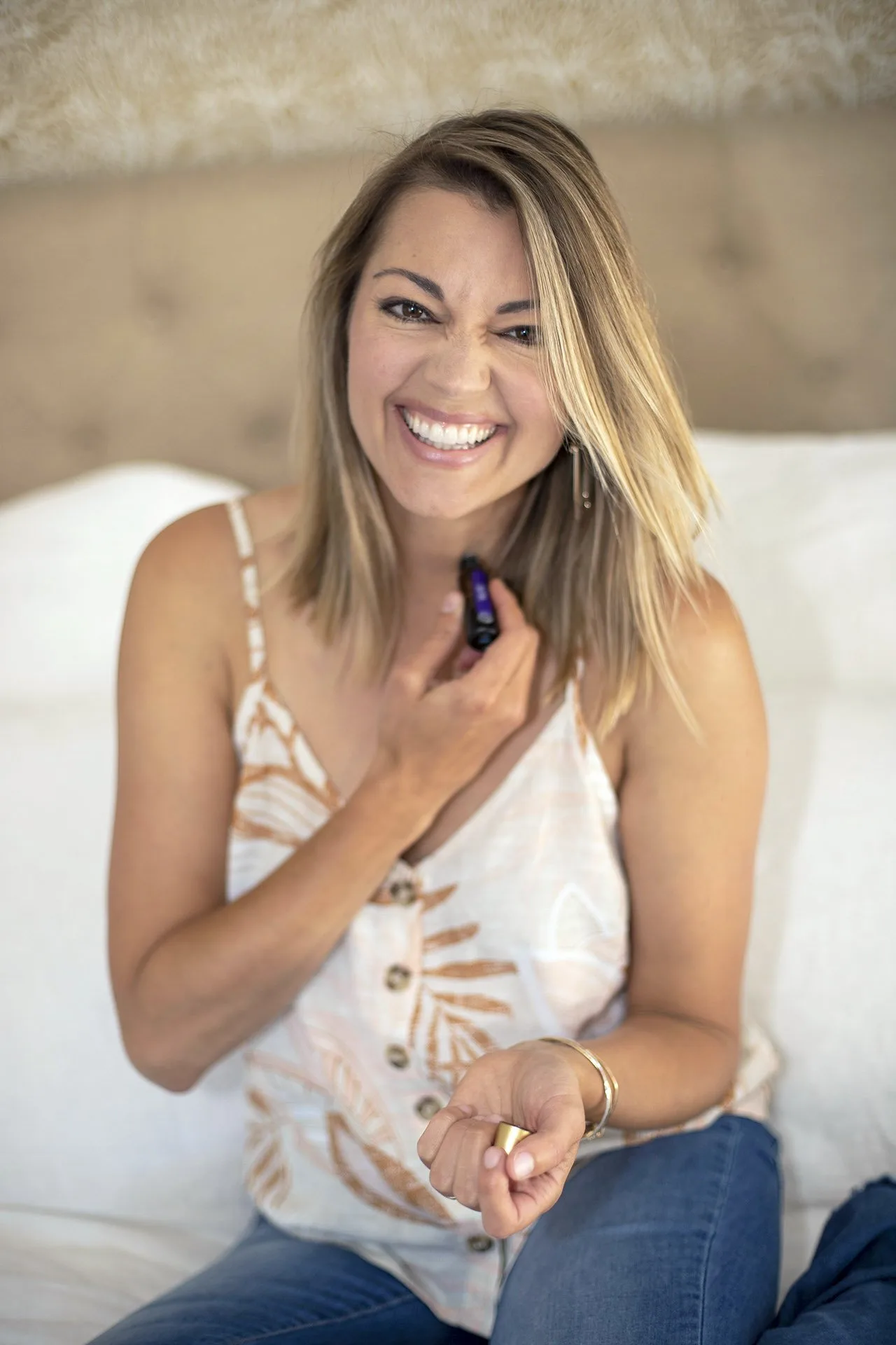 Woman putting on essential oils. 