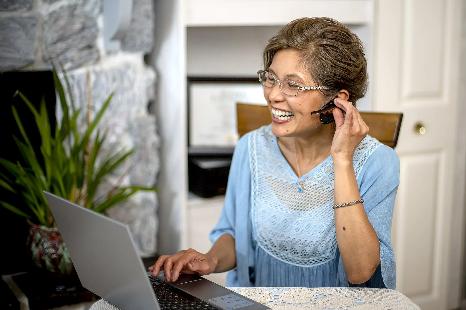 Woman working with client on her computer.